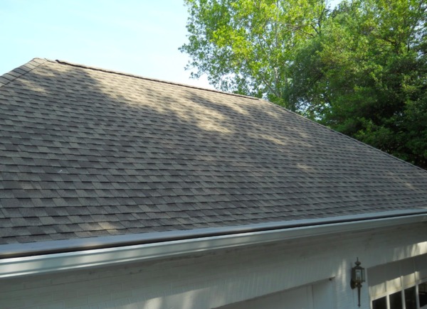 Shingled roof with gutters.